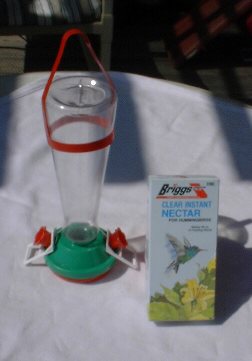 Plastic humming bird feeder